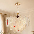 Rosette Glass Chandelier with Ruby Accents styled in a warm ivory interior