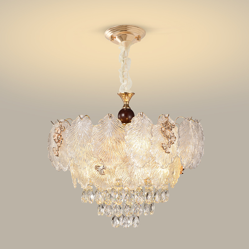 Feathered textured-glass chandelier with warm metal flourishes and crystal cascade