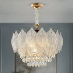 Layered Glass Leaf Chandelier with Crystal Drops styled in a cool hotel interior