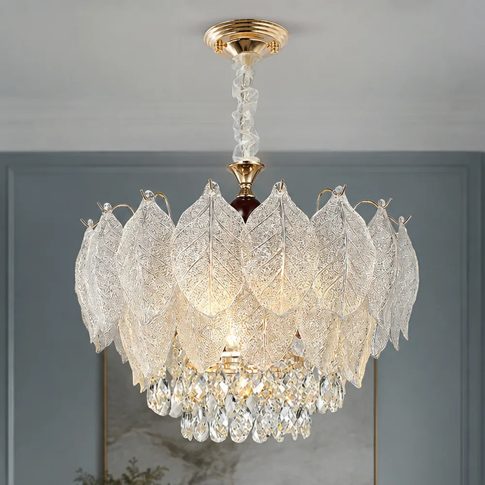 Layered Glass Leaf Chandelier with Crystal Drops styled in a cool hotel interior