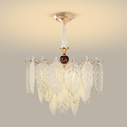 Airy veined glass leaf chandelier with warm metal frame and dark wood centre