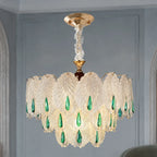 Glass Leaf Chandelier with Emerald Drops styled in a cool hotel interior