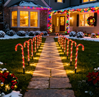Red tube candy cane stake lights lining a garden path with warm glow - multi-set scene