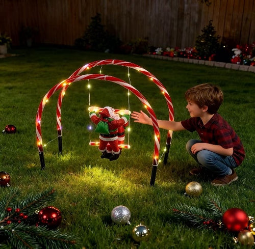 Santa Claus swinging on illuminated swings, a playful Christmas stake light - single-set scene