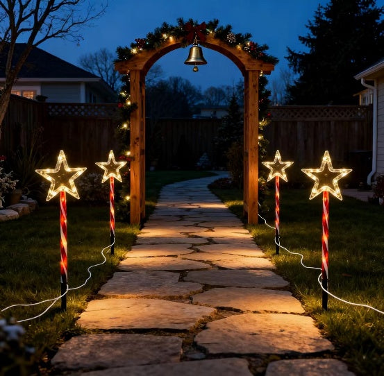 Red tube five-pointed star stake light glowing warm white on a lawn - single-set scene