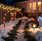 Santa Claus swinging on illuminated swings, a playful Christmas stake light - product shot