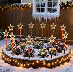Red tube five-pointed star stake light glowing warm white on a lawn - multi-set scene