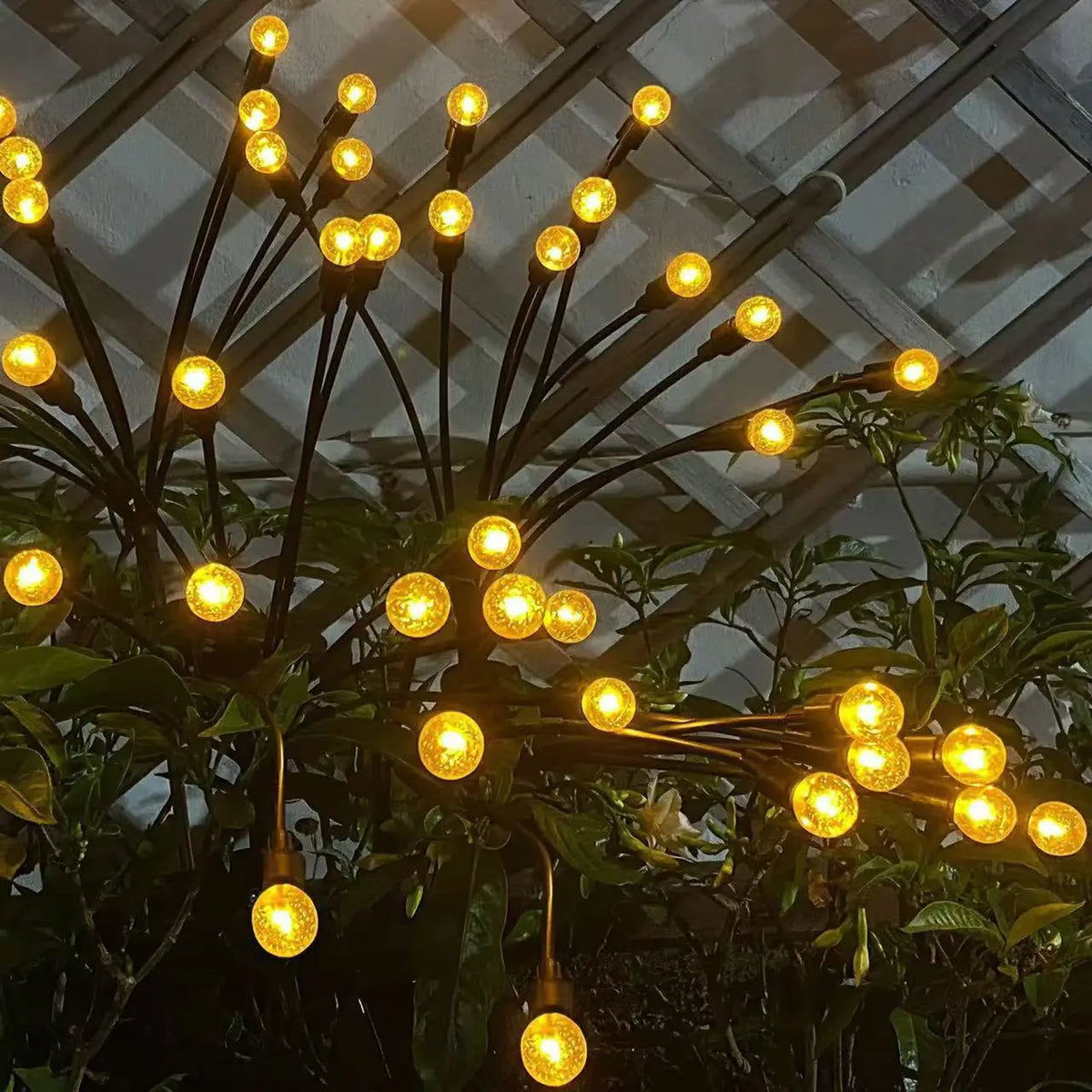 Solar Firefly Garden Stake Lights shown as solar garden stake lights for outdoor display